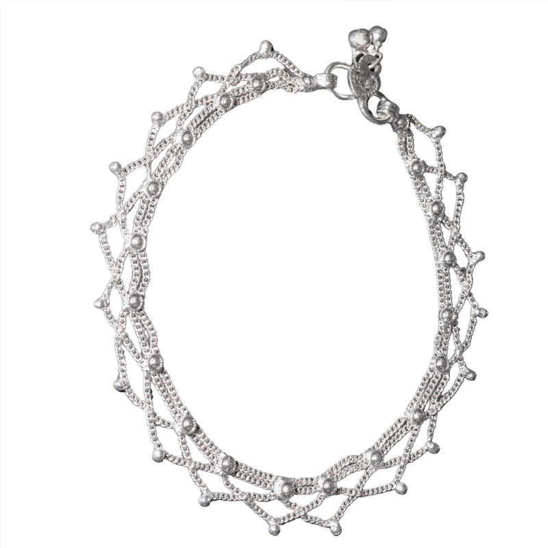 An artisan handmade solid silver, fancy beaded ankle chain designed by OMishka.