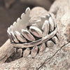 An adjustable, artisan handmade solid silver, fern leaf wrap ring designed by OMishka.