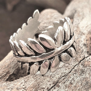 An adjustable, artisan handmade solid silver, fern leaf wrap ring designed by OMishka.