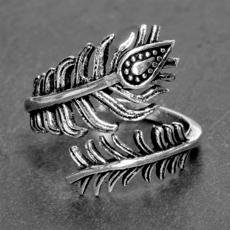 An adjustable, artisan handmade solid silver, dainty peacock feather wrap ring designed by OMishka.