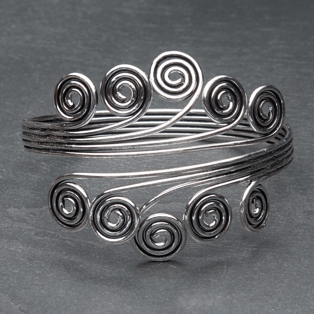 An artisan handmade silver open spiral armlet designed by OMishka.
