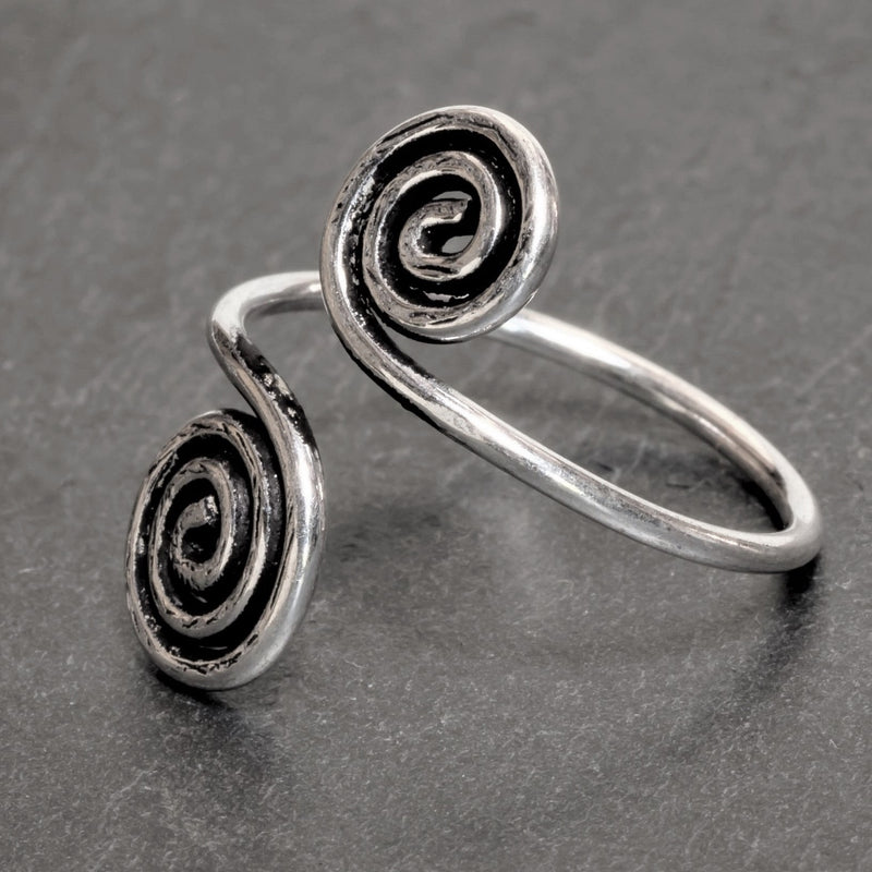 An artisan handmade,  solid silver open spiral wrap toe ring designed by OMishka.