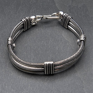 Artisan handmade silver toned brass, triple strand, subtle decorative link, snake chain bracelet designed by OMishka.