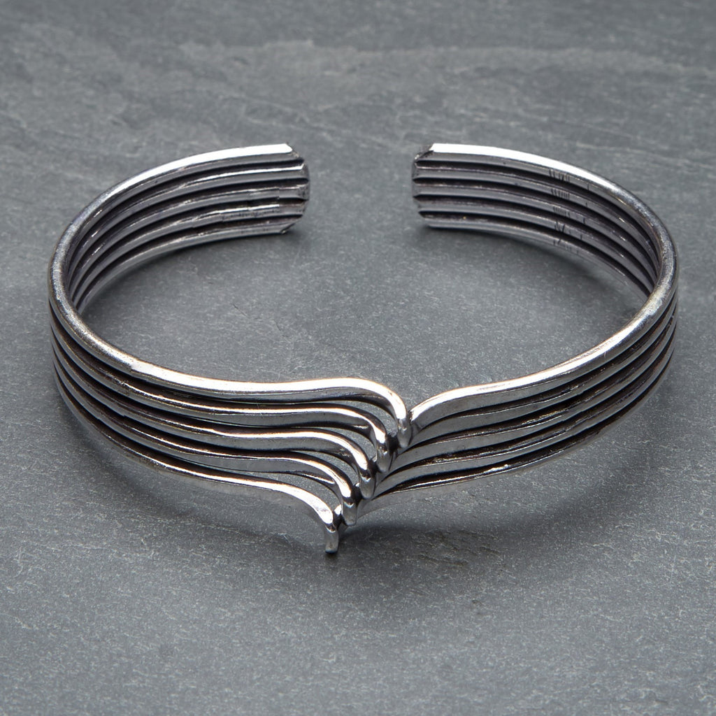 An artisan handmade, silver multi wave cuff bracelet designed by OMishka.
