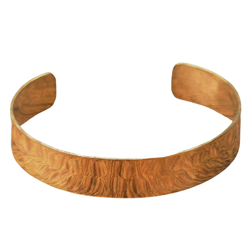 An artisan handmade, hammered pure brass simple torque bracelet designed by OMishka.