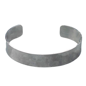 An artisan handmade, hammered silver simple torque bracelet designed by OMishka.