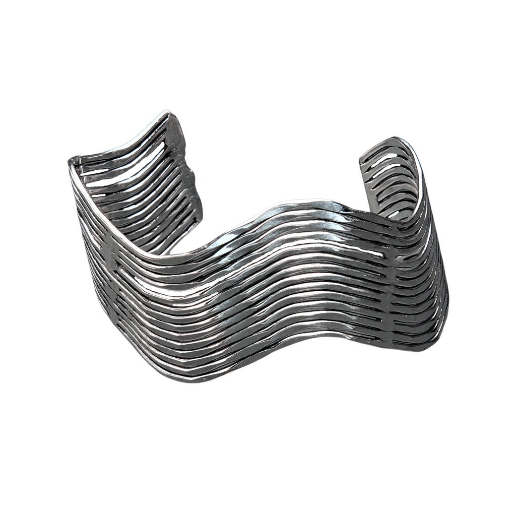 An artisan handmade, solid silver wave cuff bracelet designed by OMishka.