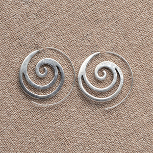 Artisan handmade solid silver, cut out wave detailed, dainty spiral hoop earrings designed by OMishka.
