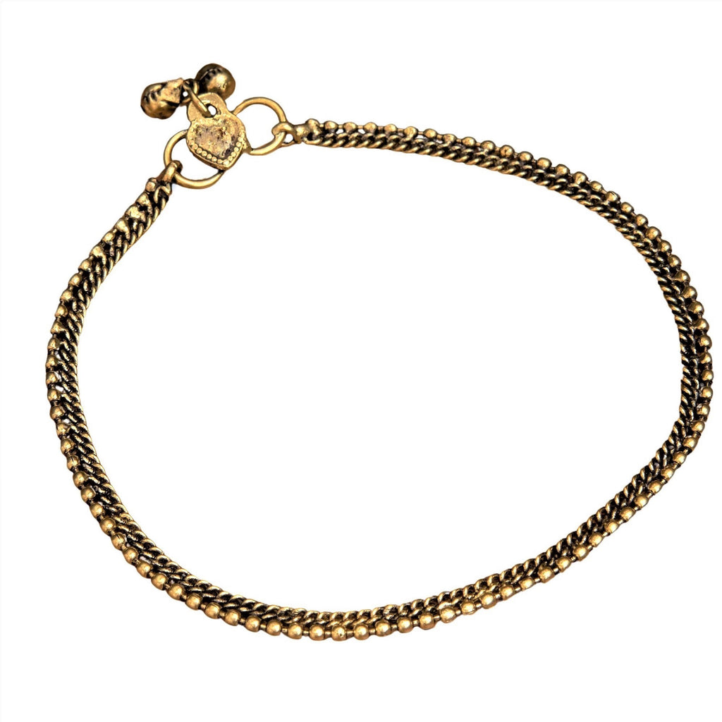An artisan handmade, thin beaded pure brass anklet with tiny bells designed by OMishka.
