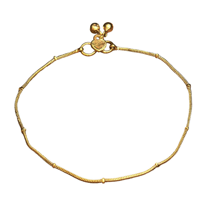 A delicate artisan handmade, pure brass thin ribbed snake chain anklet designed by OMishka.