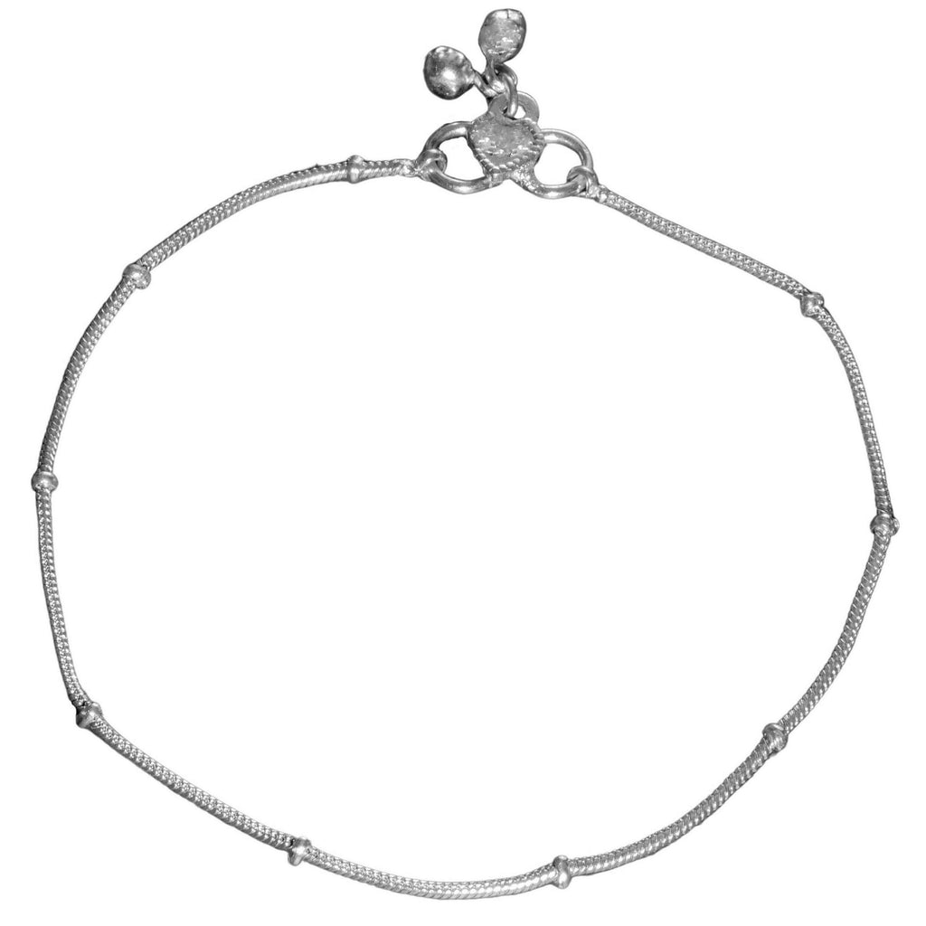 An artisan handmade, thin solid silver snake chain anklet designed by OMishka.