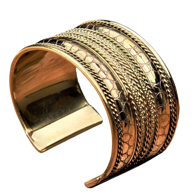 An artisan handmade, wide pure brass, spotty patterned and striped cuff bracelet designed by OMishka.