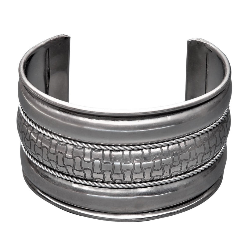 An artisan handmade wide silver striped, geometric patterned cuff bracelet designed by OMishka.