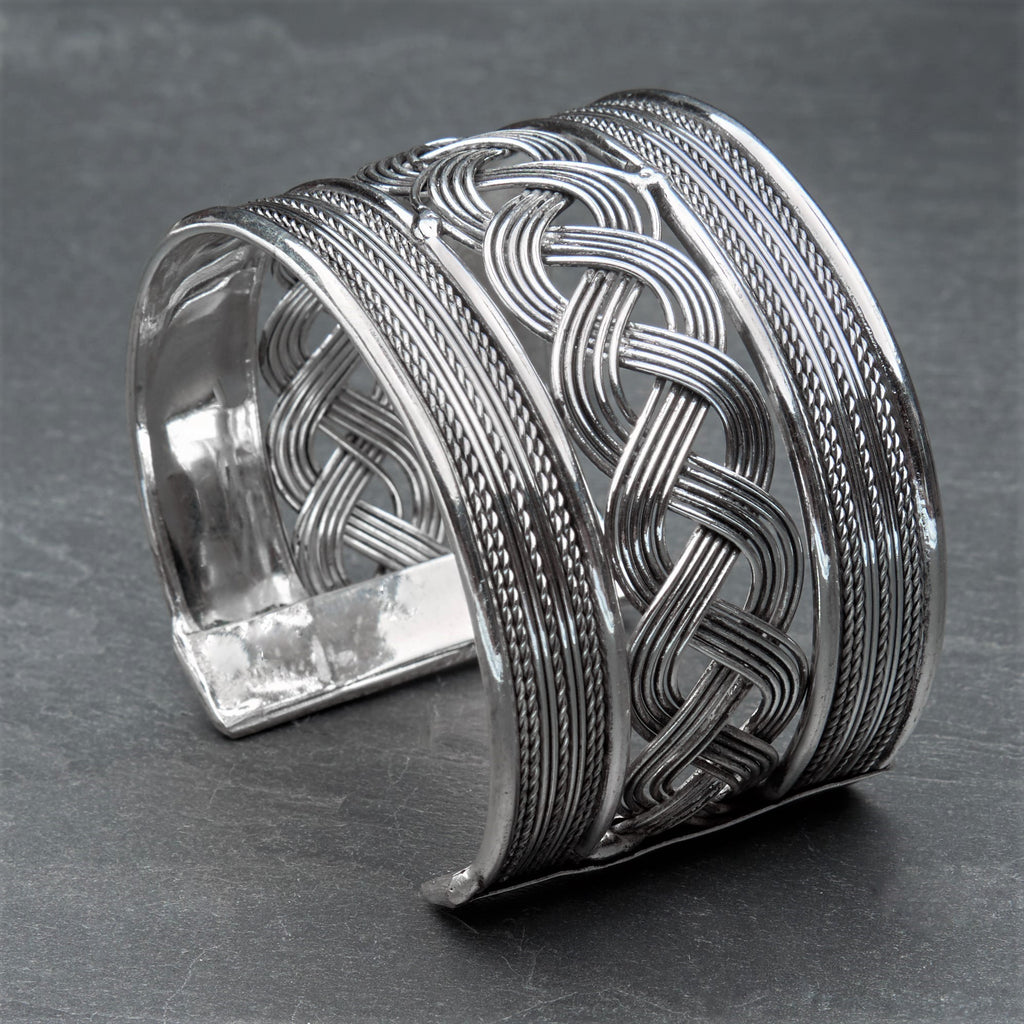 A wide artisan handmade, silver woven patterned cuff bracelet designed by OMishka.