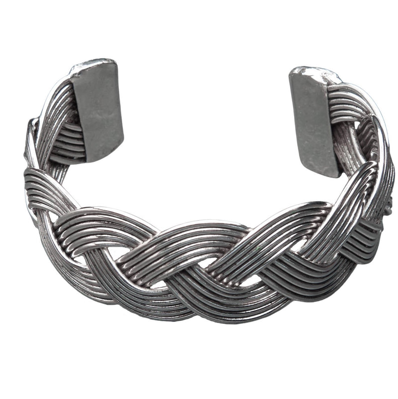 An artisan handmade, woven silver braid cuff bracelet designed by OMishka.