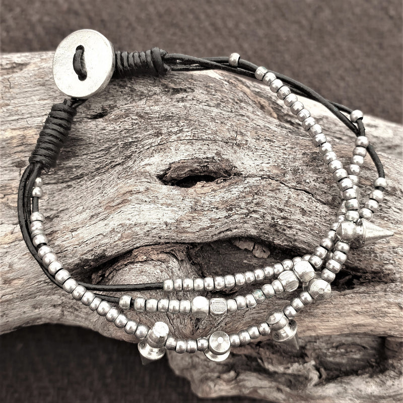 Artisan handmade silver toned, beaded spike charm and black cord dainty bracelet designed by OMishka.