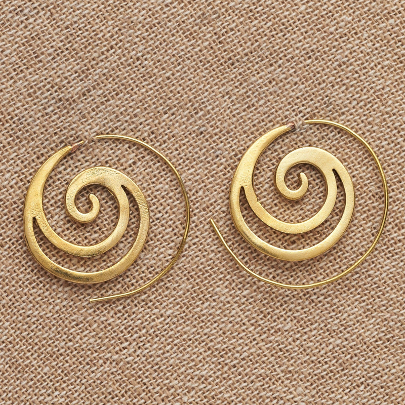 Handmade pure brass, cut out crested wave spiral hoop earrings designed by OMishka.
