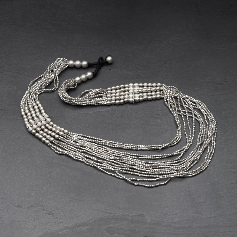 Handmade nickel free silver chunky layered, tiny cube and charm beaded, multi strand necklace designed by OMishka.