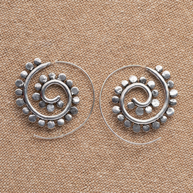 Handmade, chunky, nickel free solid silver, dotted spiral hoop earrings designed by OMishka.