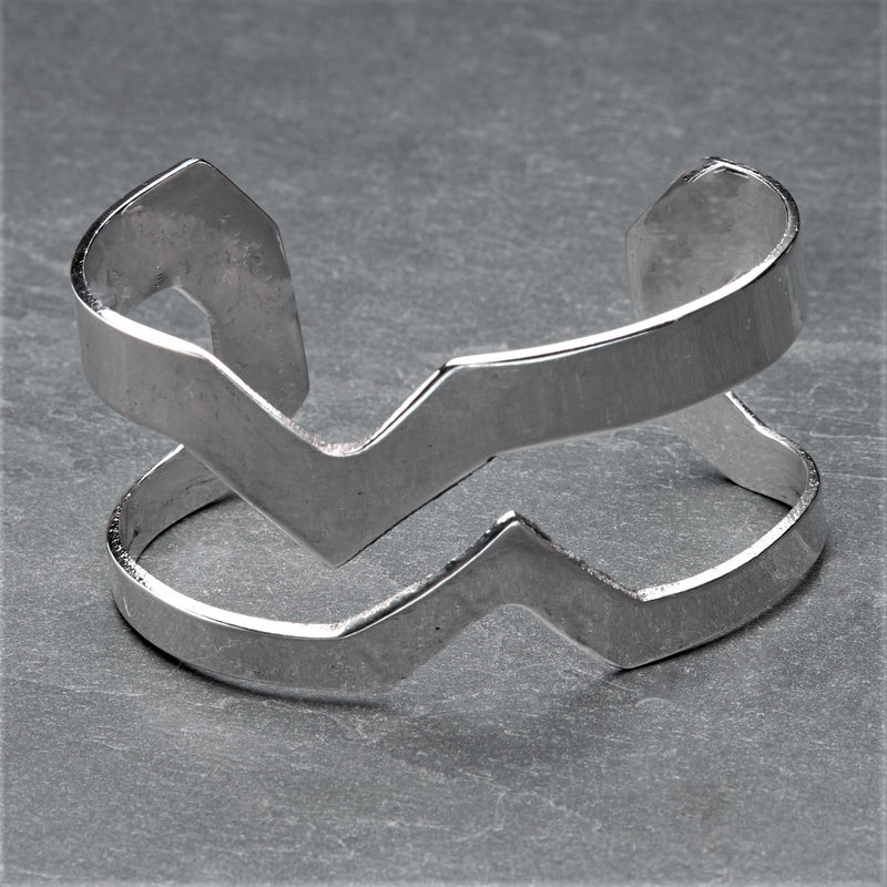 A chunky cut out zig zag, adjustable silver cuff bracelet designed by OMishka.