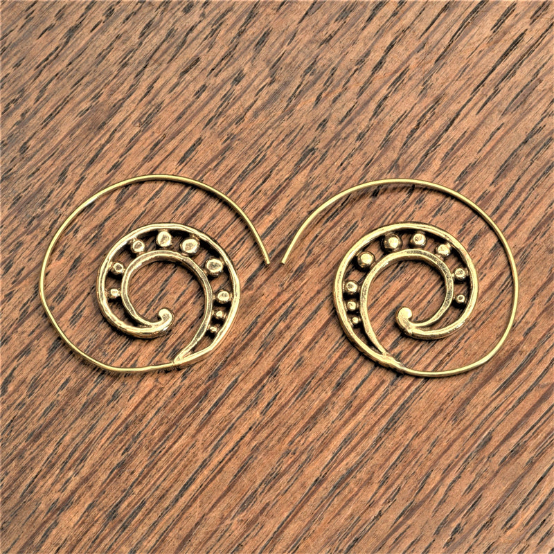 Handmade nickel free pure brass, galactic swirl, dainty spiral hoop earrings designed by OMishka.