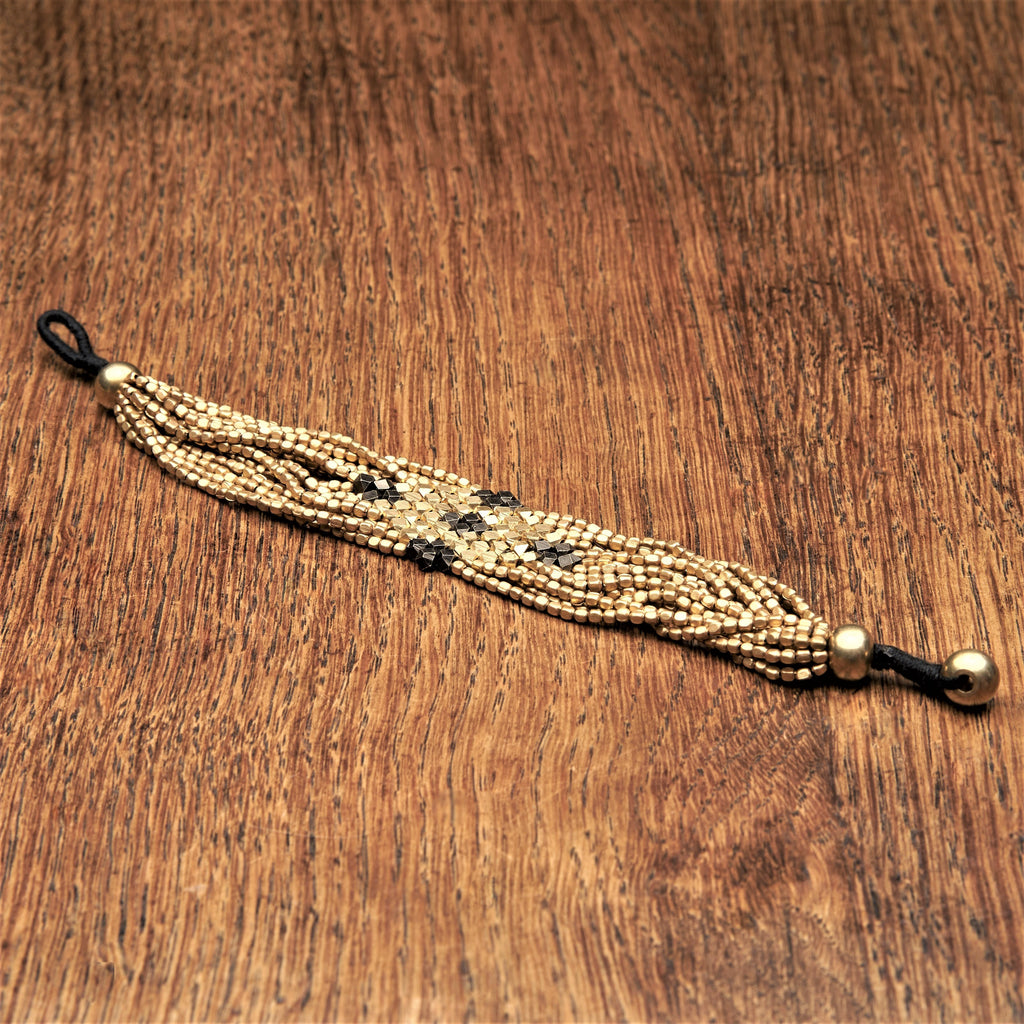 Two tone, golden and oxidised black brass,  beaded diamond shaped, multi strand bracelet designed by OMishka.