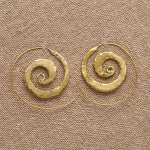 Handmade pure brass, flat, hammered textured spiral hoop earrings designed by OMishka.