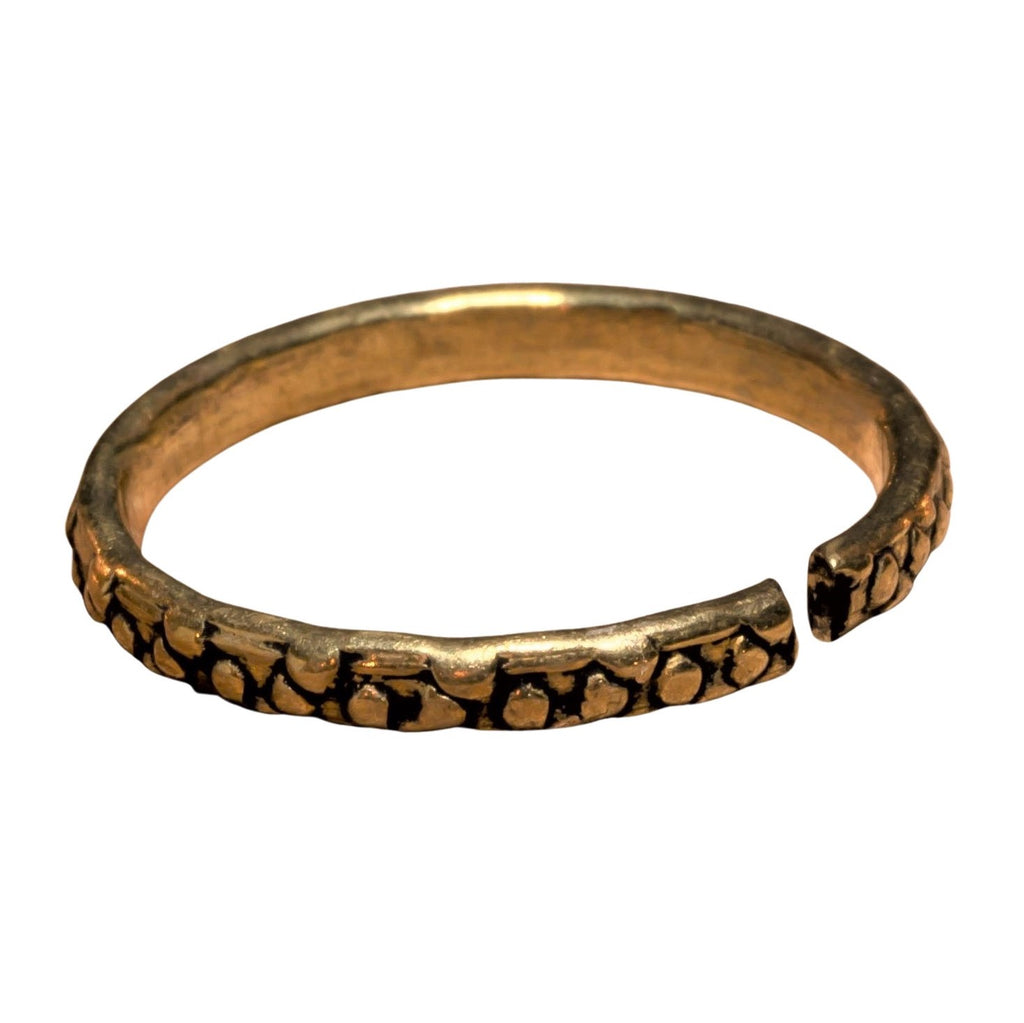A handmade, adjustable, dainty pure brass dotted band toe ring designed by OMishka.