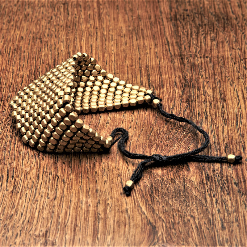 Handmade pure brass, adjustable Naga Tribe woven beaded bracelet designed by OMishka.