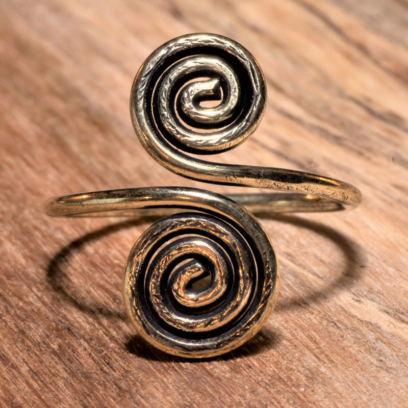A handmade, adjustable wrap pure brass open spiral toe ring designed by OMishka.