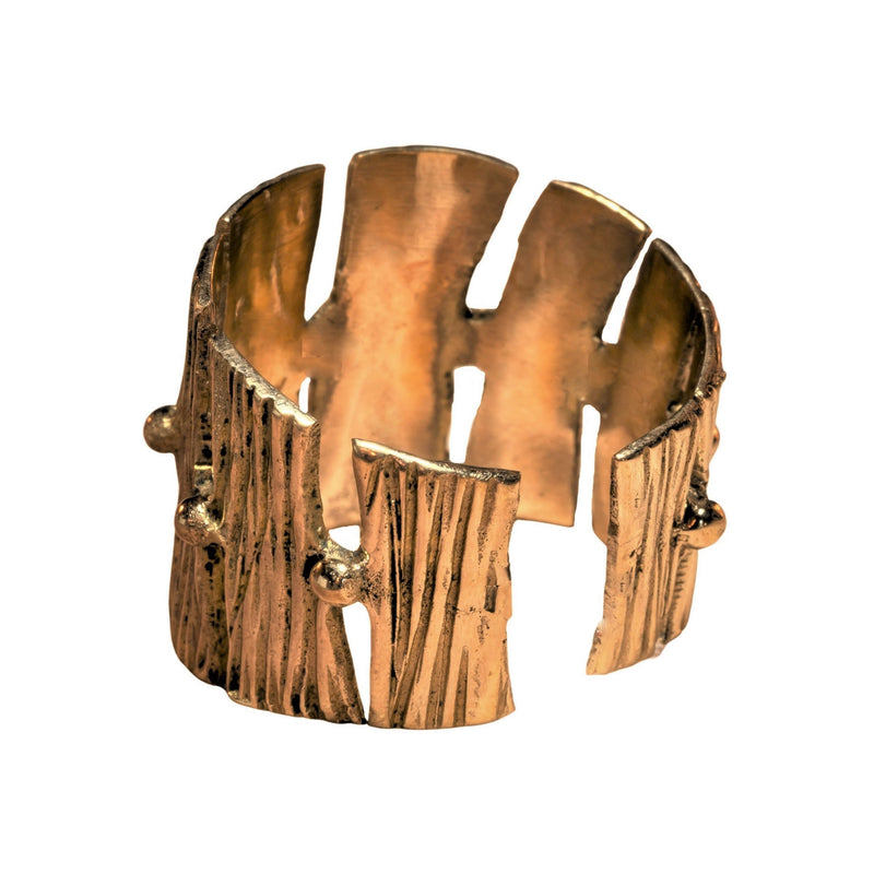 An adjustable, chunky, handmade pure brass, tree bark textured ring designed by OMishka.