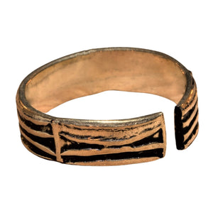 A handmade, adjustable pure brass, etched tree bark patterned band toe ring designed by OMishka.