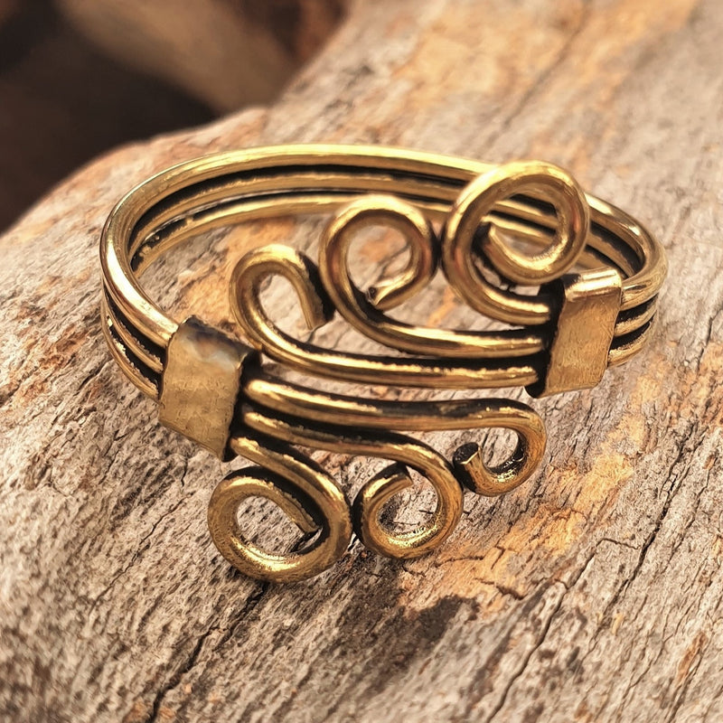 An adjustable, handmade pure brass, triple wave, wrap ring designed by OMishka.