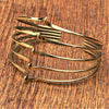 A handmade adjustable pure brass, multi wave open cuff bracelet designed by OMishka.