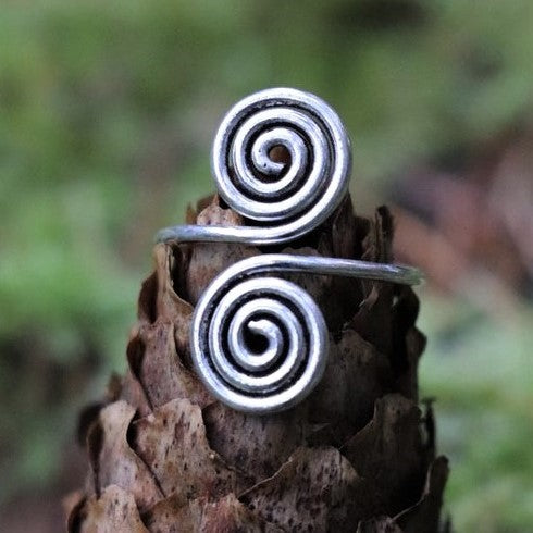 A handmade, adjustable wrap solid silver open spiral toe ring designed by OMishka.