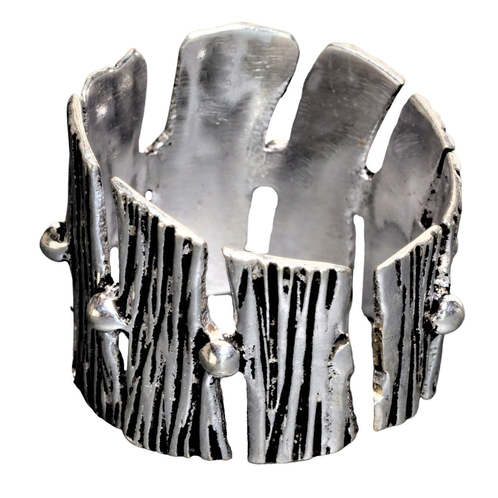 A handmade, chunky, adjustable solid silver, tree bark textured ring designed by OMishka.