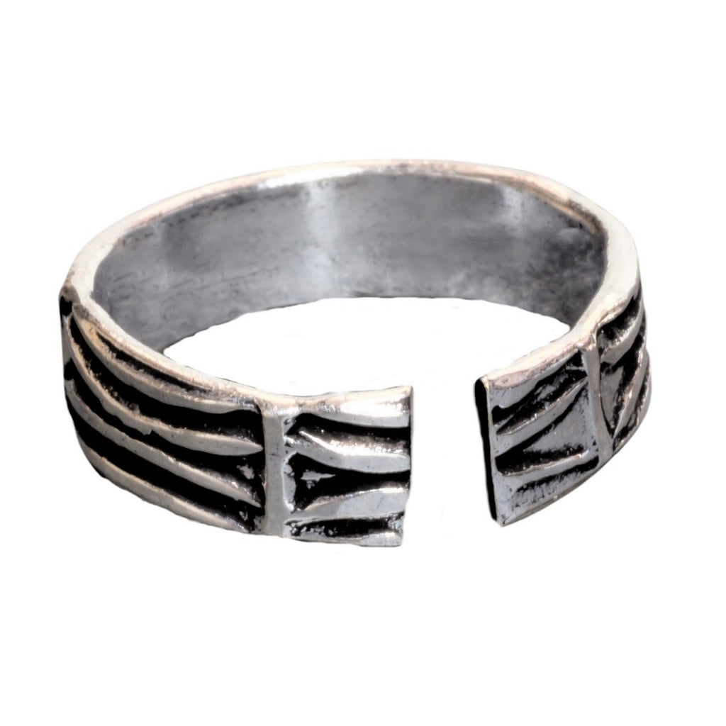 A handmade, adjustable solid silver, etched tree bark patterned band toe ring designed by OMishka.
