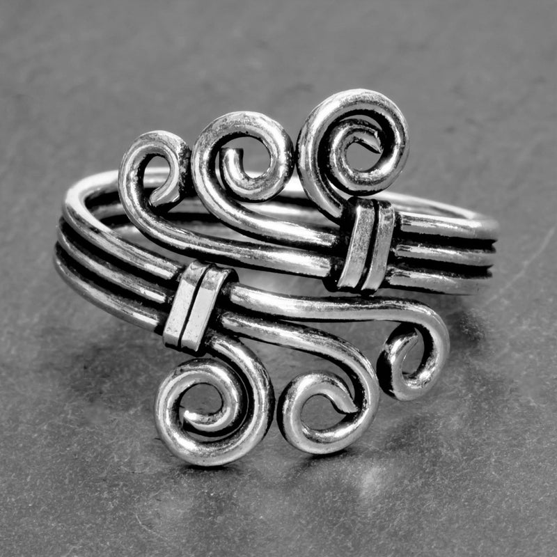 An adjustable, handmade solid silver, triple wave wrap ring designed by OMishka.