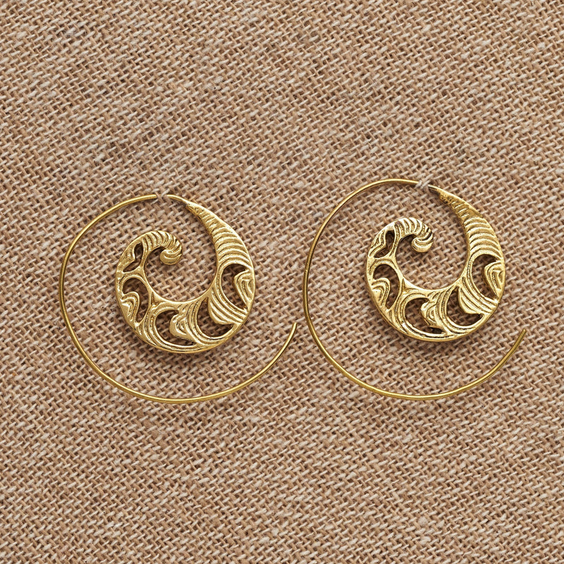 Handmade pure brass, dainty, crescent and swirl patterned spiral hoop earrings designed by OMishka.