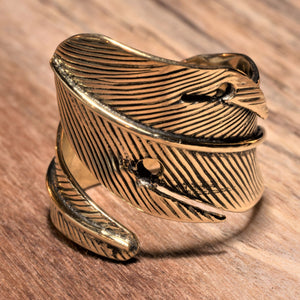 A handmade, pure brass, chunky feather wrap ring designed by OMishka.