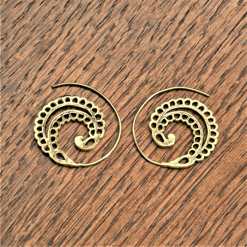 Handmade solid silver, dainty fern leaf, ear hugging spiral hoop earrings designed by OMishka.