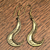 Handmade pure brass, tribal patterned, long swirl shaped dangle earrings designed by OMishka.