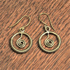 Handmade pure brass, open circle and spiral detail, drop hook earrings designed by OMishka.