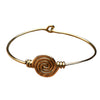 A handmade pure brass spiral patterned bangle designed by OMishka.