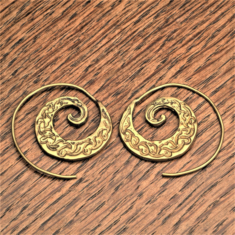 Handmade pure brass, dainty swirl patterned spiral hoop earrings designed by OMishka.