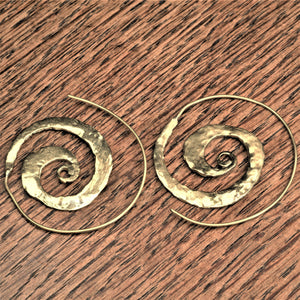 Handmade pure brass, flat, hammered textured spiral hoop earrings designed by OMishka.