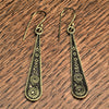 Handmade, oxidised pure brass, long teardrop, spiral etched dangle earrings designed by OMishka.