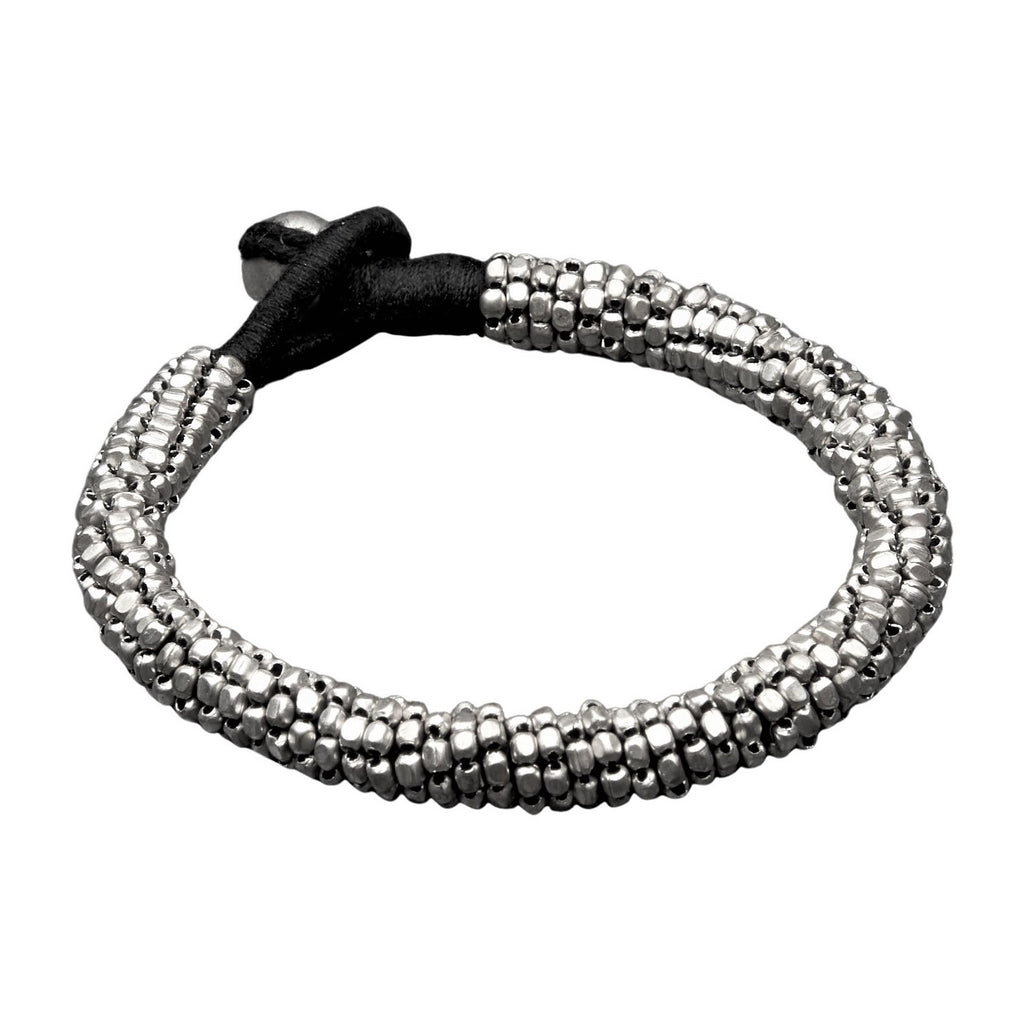 Handmade, slim coiled, nickel free silver beaded bracelet with a bead and hoop closure, designed by OMishka.