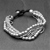 Handmade silver, tiny cube and large ball beaded multi strand bracelet designed by OMishka.