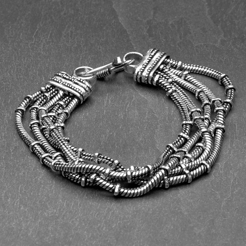 Handmade silver toned white metal, multi five strand, subtle beaded snake chain bracelet designed by OMishka.